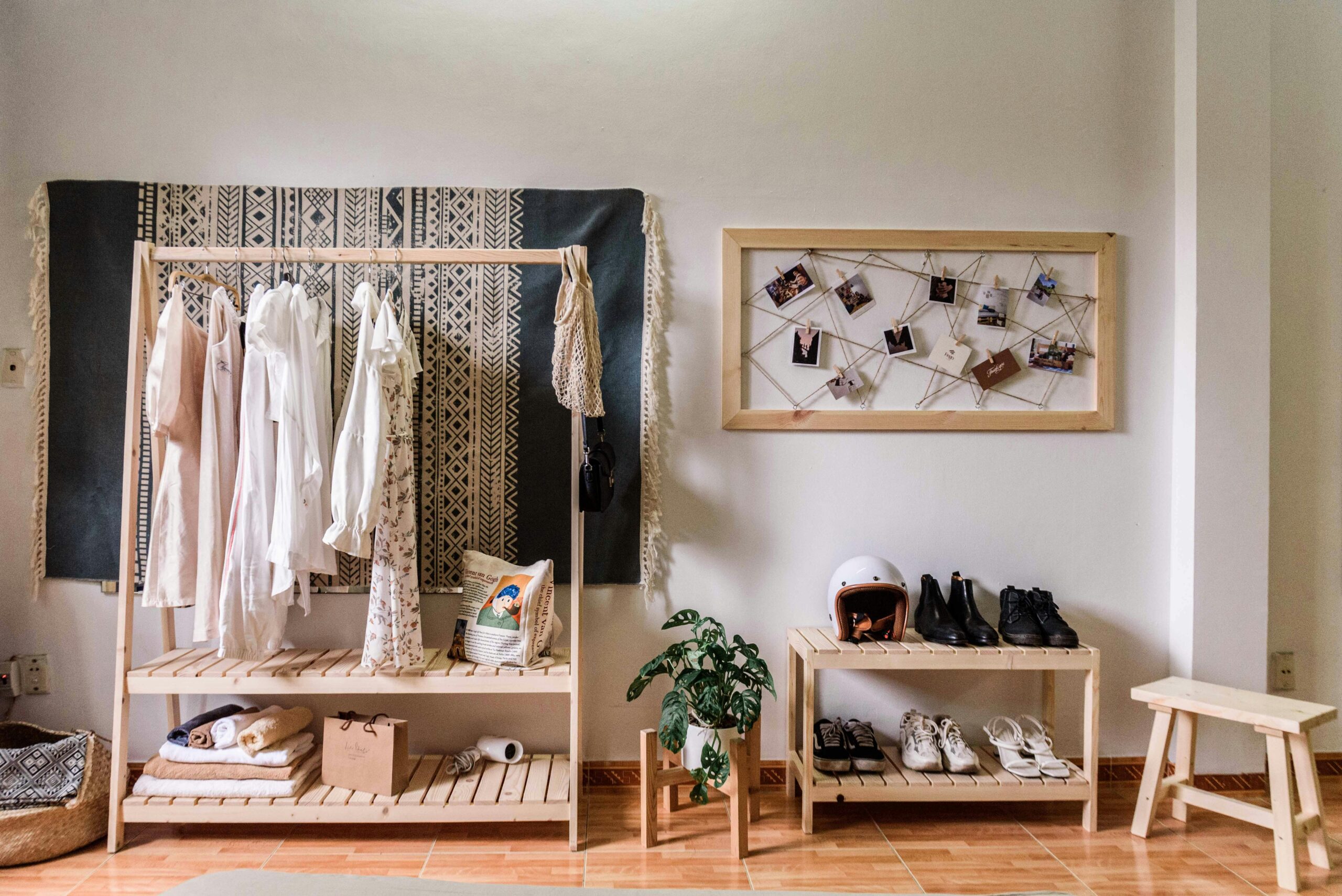 DIY Simple Coat Racks from Scrap Wood: A Guide Stylish room with minimalist wardrobe and decor, showcasing clothing and shoes.