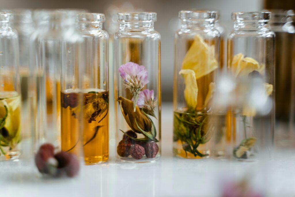 Aromatherapy Diffusers for Stress Relief Guide Close-up of assorted dry flowers immersed in glass vials, ideal for natural fragrance products.